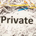 Shredded paper surrounding the word "Private".